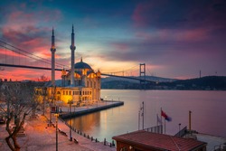 Istanbul. Image of Ortakoy Mosque with Bosphorus Bridge in Istanbul during beautiful sunrise.