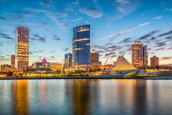 Milwaukee, Wisconsin, USA downtown city skyline on Lake Michigan at twilight.