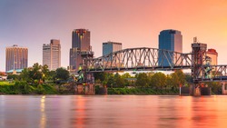Little Rock, Arkansas, USA skyline on the river at twilight.