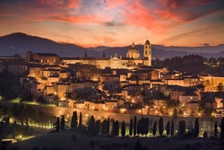Urbino, Italy medieval walled city in the Marche region at twilight.
