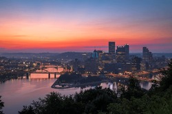 Pittsburgh, Pennsylvania, USA city skyline on the three rivers at dawn.