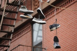 Hanging shoes from a wire.