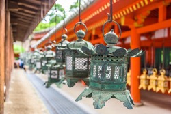 Nara, Japan at Kasuga Taisha Shrine hanging lanterns.