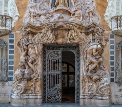 Ornate alabaster stone facade of the historic Palace of Marques de Dos Aguas national ceramic museum in Valencia, Spain.