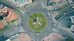 Aerial shot of Plaza de Espana in Barcelona, Spain. Roundabout city traffic, top view