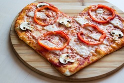 Pizza in the form of a heart.