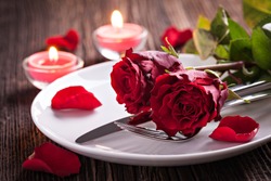 table setting for valentines day with roses