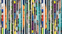 Stack of old vintage comic books background texture