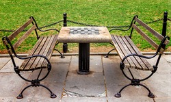 Chess table with empty benches in City Hall Park in Manhattan New York City NYC