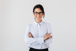 Photo of pretty businesslike woman wearing eyeglasses standing in the office isolated over white background