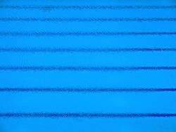 Trembling surface of an Olympic size swimming pool with parallel stripes