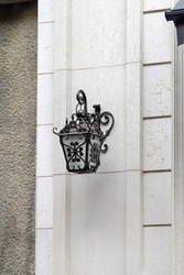 Decorative Ironwork Lantern at White Building Wall
