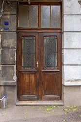 Closed Old Wooden Doors With Glass and Ironwork