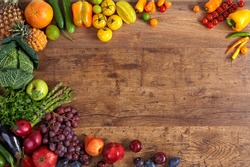Healthy eating background / studio photography of different fruits and vegetables on old wooden table 