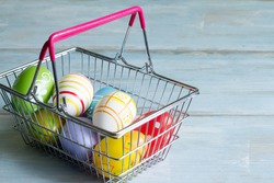 Commercial concept with easter eggs in a shopping basket