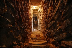 narrow tunnel in the wall of a fortress