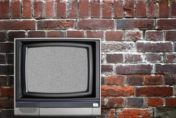Vintage TV and brick wall