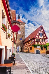 Rothenburg ob der Tauber, Germany. Siebersturm, narrow medieval street on idyllic Romantic Road town, famous travel place in Bavaria.