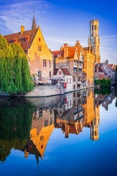 Bruges, Belgium. Golden hour landscape with beautiful Rozenhoedkaai in Brugge, famous Flanders landmark.