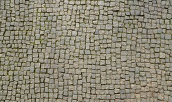 Abstract background of old cobblestone pavement view from above