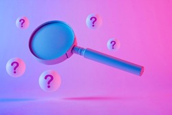 Studio close-up of an old magnifying glass floating between spheres with question marks against purple background as symbol for research and complicated investigations