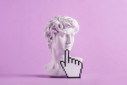 Historical antique statue of david's head and mouse cursor with finger. Concept of modern art and vaporwave and cyberpunk