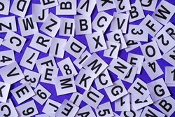 Letters and numbers on a purple trendy background as an idea for education and language learning information of typography and school fonts.
