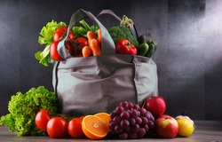 Shopping bag with fresh vegetables and fruits.