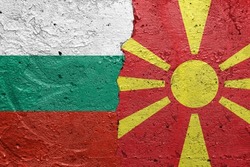 Bulgaria and North Macedonia flags  - Cracked concrete wall painted with a Bulgarian flag on the left and a North Macedonian flag on the right