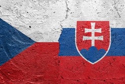 Czech Republic and Slovakia - Cracked concrete wall painted with a Czech flag on the left and a Slovakian flag on the right