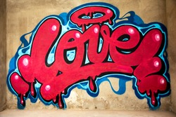 awesome graffiti of the word love sprayed on a wall 