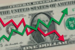 Blurred one US dollar bill with green stock market chart arrow going up and red arrow going down. Dollar exchange rate going both up and down concept.