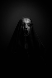Possessed Woman screaming with her face covered