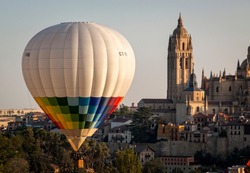 Aerostatic balloon festival over the city of Segovia, Castilla y León. Spain. Adventures with friends and family, flights. Flying at sunrise in a balloon