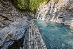 Beautiful clear turquoise mountain river below the natural bridge new Radium Hot Springs British Columbia on the Nipika Trails.