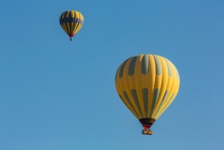 Hot air balloon profiled on deep blue sky
