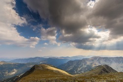 Beautiful mountain scenery in the Transylvanian Alps with storm clouds, in summer