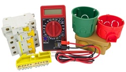 Electrical modular circuit breaker, digital multimeter and plastic electrical junction boxs on white background
