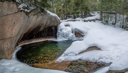 The Basin in Franconia Notch State Park during winter . New Hampshire mountains. USA