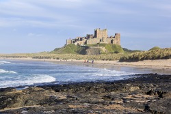 bamburgh castle in northumberland on the north east coast of england, sitting high on a rocky plateau it is one of the larget inhabited castles in the uk