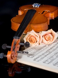 Sheet music of the Wedding March, with roses and violin