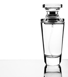 Perfume bottle on a glass surface