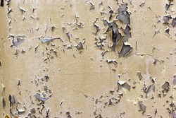 Chipped paint texture with scratches showing the raw metal.