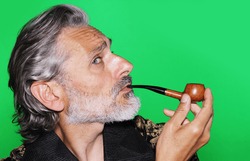 mature man wearing robe and smoking pipe