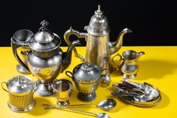 Antique silverware on a bright colored background