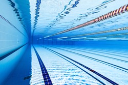 Swimming pool underwater blue background.