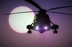 Helicopter flying at sunset