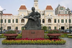 Statue of Ho Chi Minh and Peoples Committee Building, Saigon, Vietnam. Image by Kevin Hellon