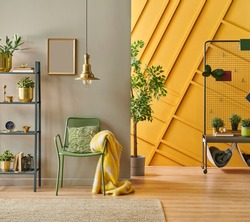 Modern room interior concept, grey bookshelf, gold lamp and frame close up, green metal chair with pillow and blanket style, brown and yellow decorative wall.