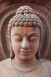 Buddha face , rock engraving